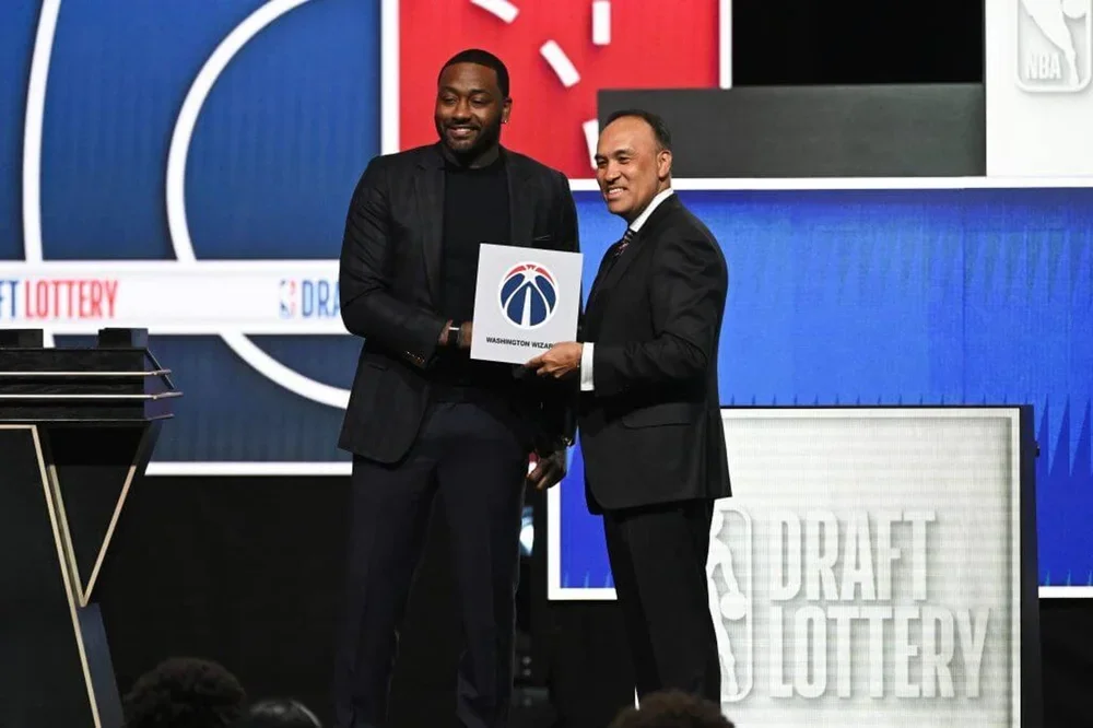 John Wall and Mark Tatum pose for a photo after the Washington Wizards win the 1st overall pick during the 2026 NBA Draft Lottery on May 10, 2026 at Navy Pier in Chicago